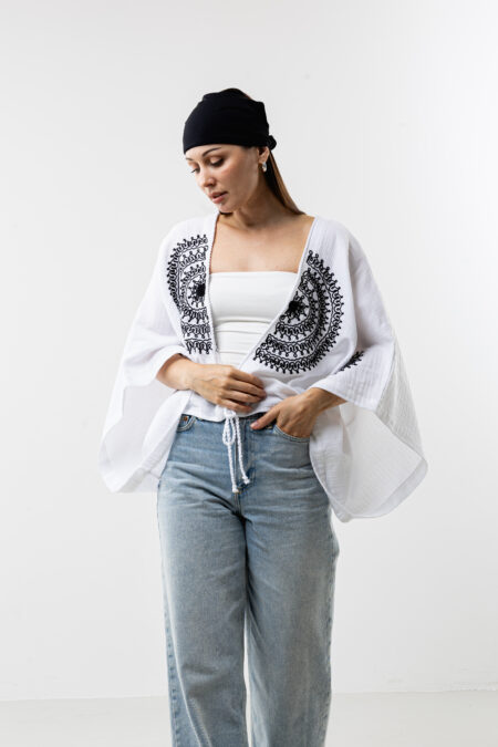 Artisanal mandala embroidery muslin crop blouse; white handcrafted cotton top for sustainable resort wear, travel, and bohemian style.