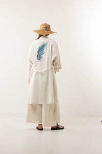 blue-feather-hand-painted-speckled-linen-long-kimono Blue feather hand-painted speckled linen long kimono; artisanal textured wrap dress for sustainable resort wear, travel, and bohemian luxury.
