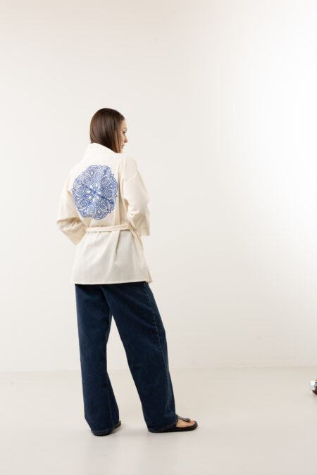 Back view of a cotton kimono jacket featuring a large hand-painted blue mandala.