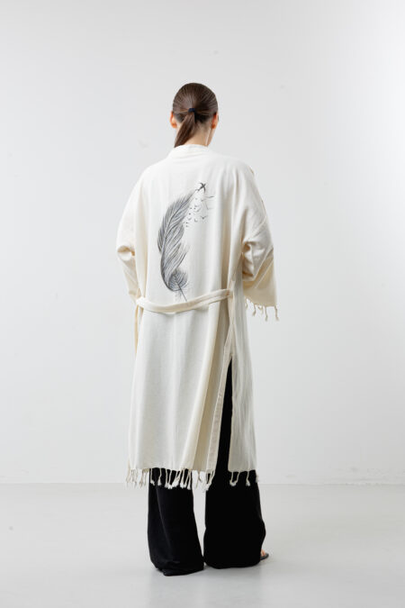 Hand-painted black feather wrap long kimono; bohemian natural cotton robe and dress for sustainable resort wear, travel, and all-season style.