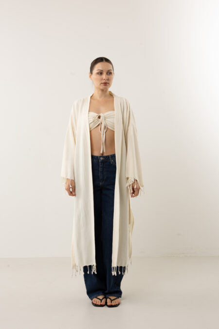 Bohemian hand-painted blue feather wrap kimono; artisanal speckled linen duster for sustainable resort wear, travel, and coastal luxury style.
