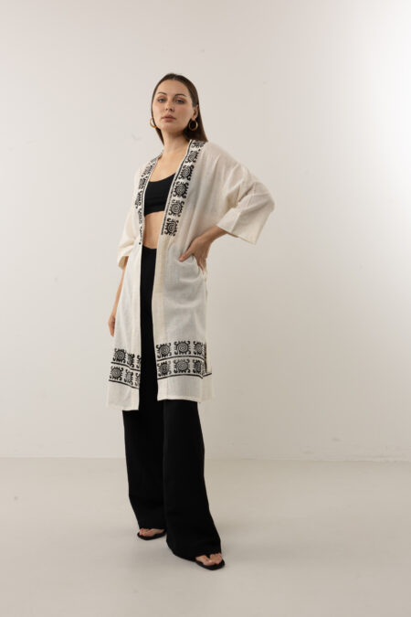 Speckled linen-cotton kimono with black hand-pressed celestial symbols.