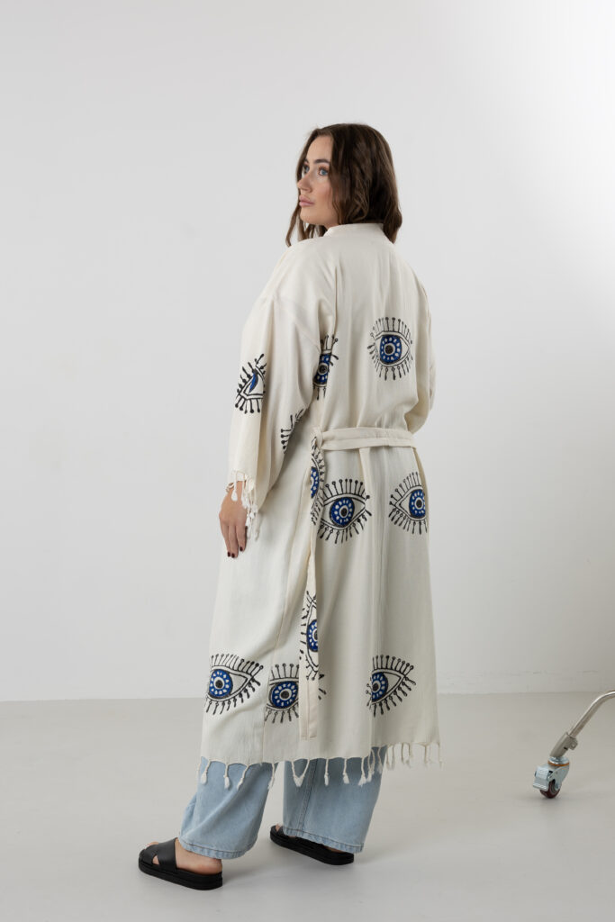 Hand block printed blue cotton long kimono with black artisanal evil eye motifs.