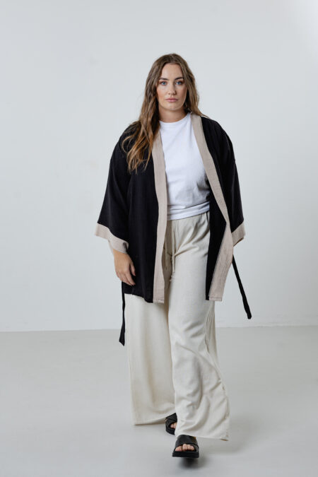 Hand-painted puma short muslin kimono; black jacket with cream cuffs and collar for sustainable resort wear, travel, and all-season luxury style.