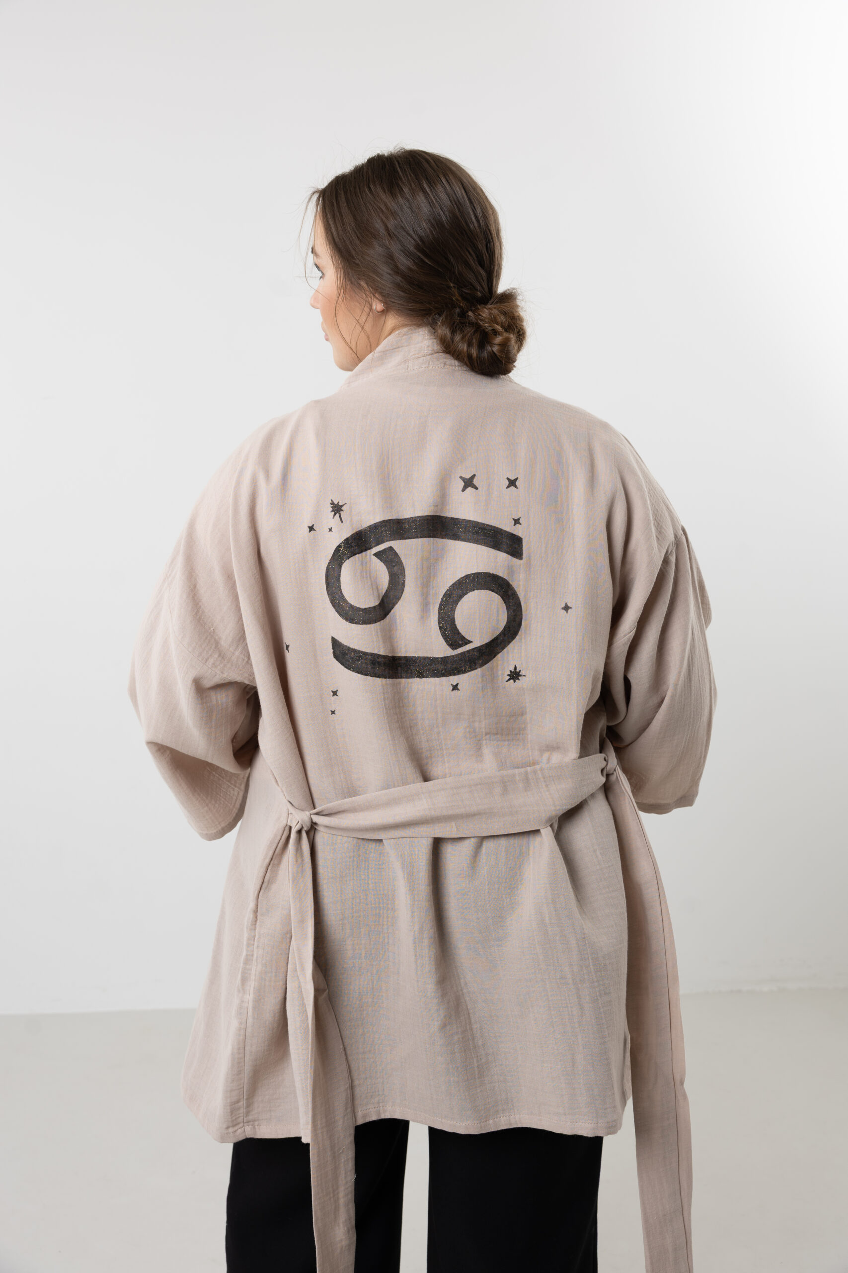 Hand-painted zodiac mini muslin kimono; multi-color naturally dyed jacket with black celestial symbols for sustainable resort wear and travel.