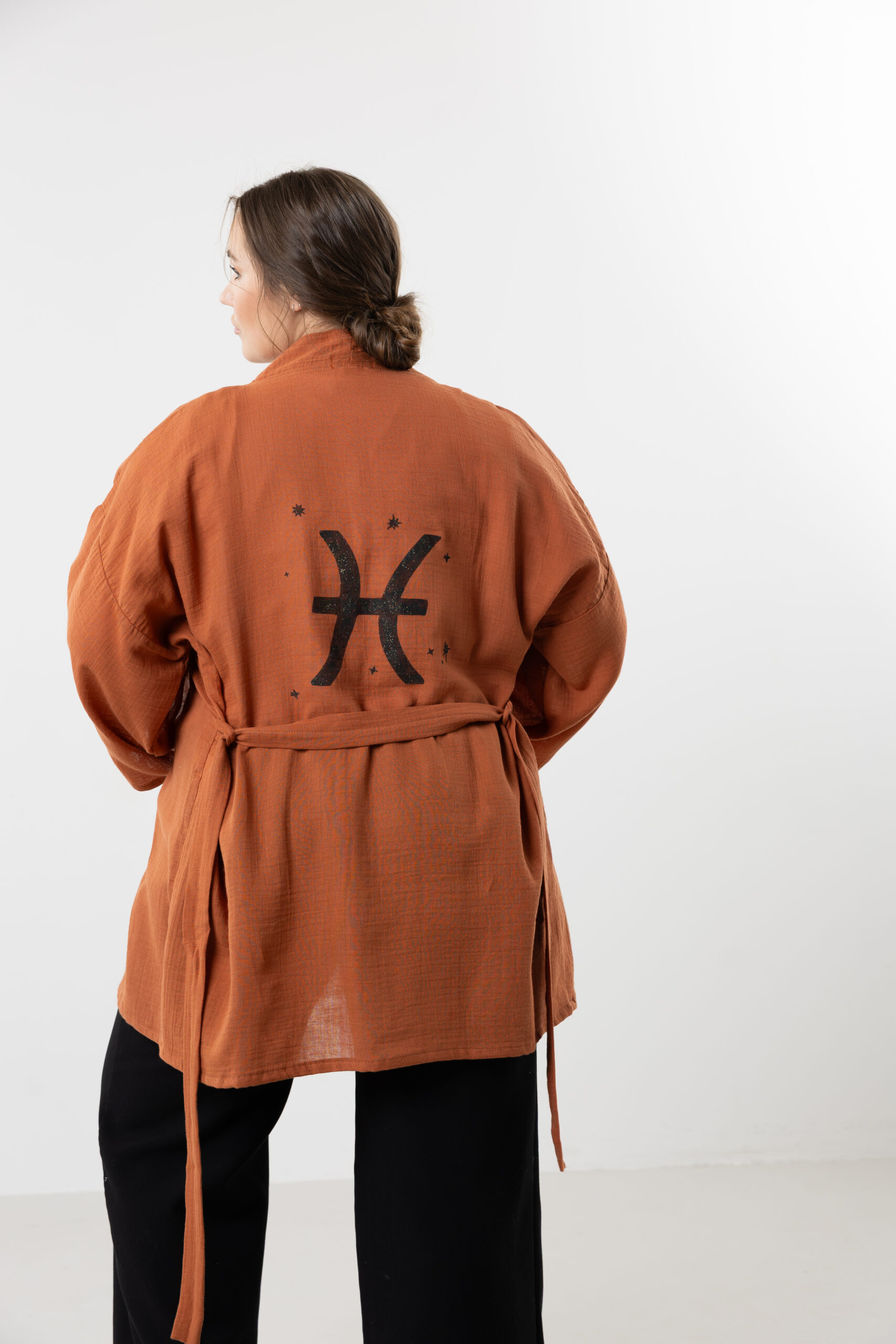 Hand-painted zodiac mini muslin kimono; multi-color naturally dyed jacket with black celestial symbols for sustainable resort wear and travel.