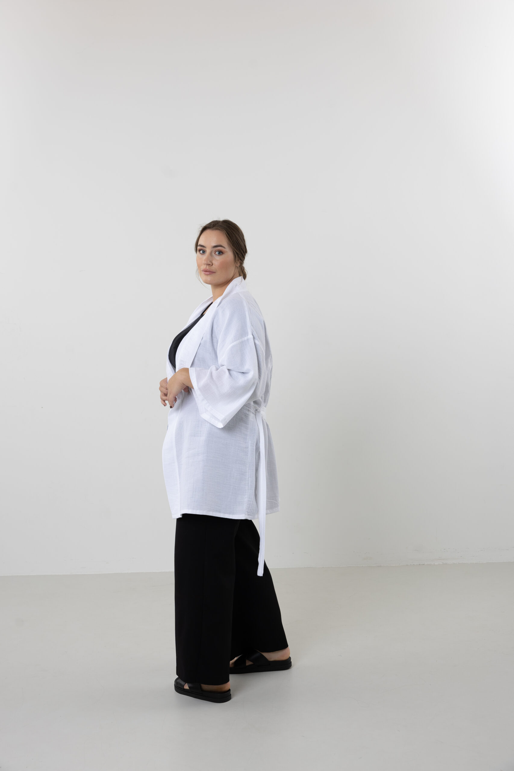 Hand-painted zodiac mini muslin kimono; multi-color naturally dyed jacket with black celestial symbols for sustainable resort wear and travel.