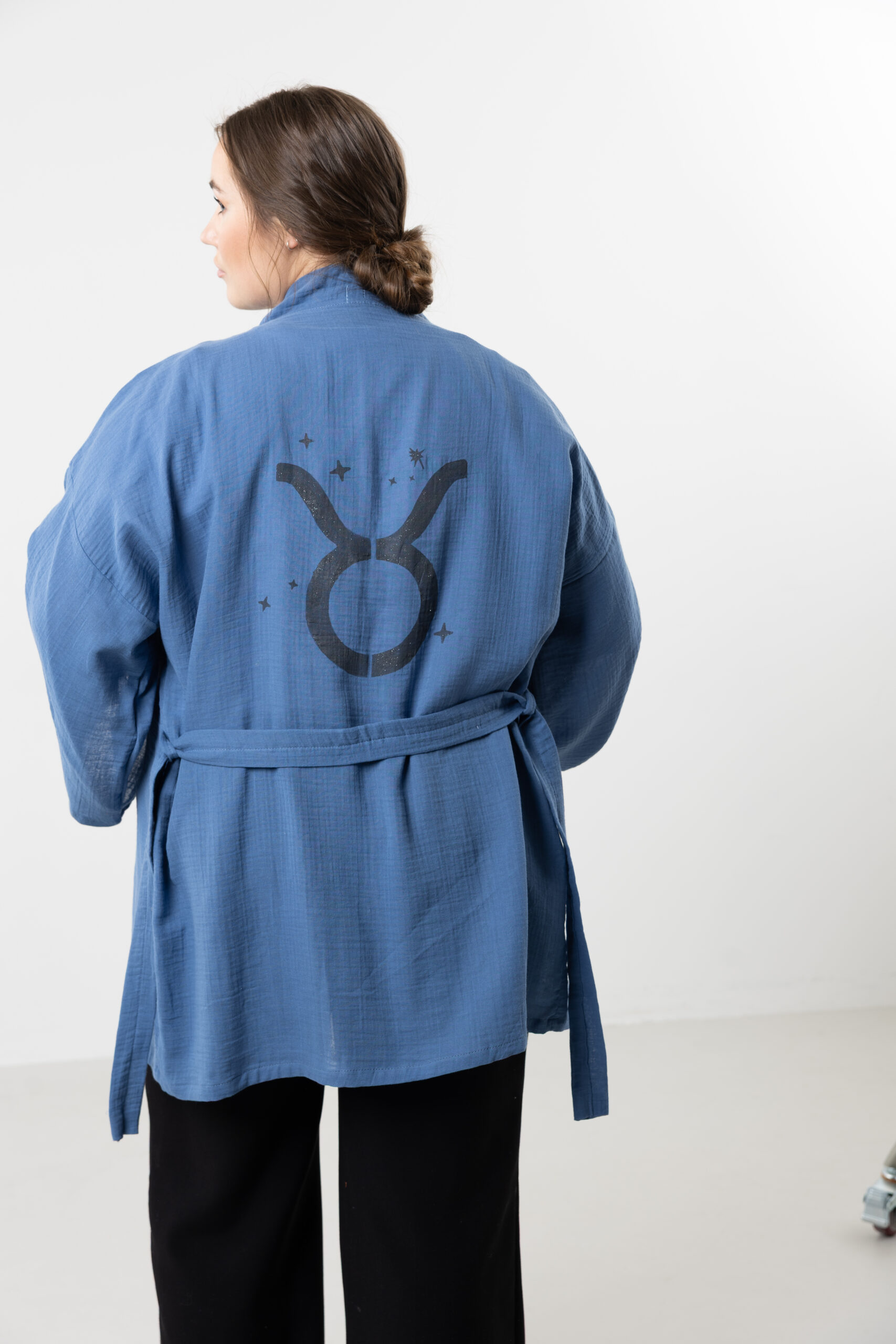 Hand-painted zodiac mini muslin kimono; multi-color naturally dyed jacket with black celestial symbols for sustainable resort wear and travel.