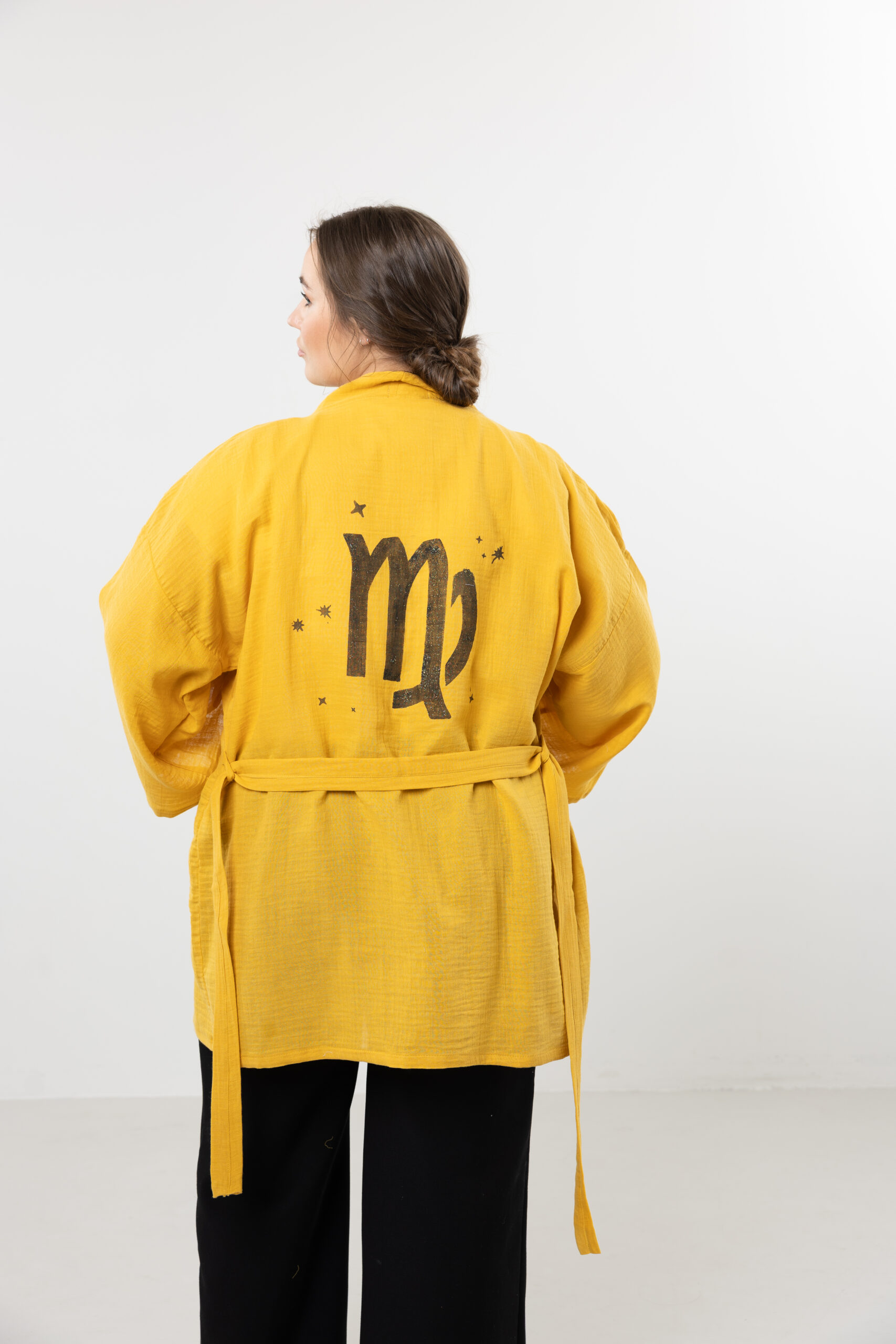 Hand-painted zodiac mini muslin kimono; multi-color naturally dyed jacket with black celestial symbols for sustainable resort wear and travel.