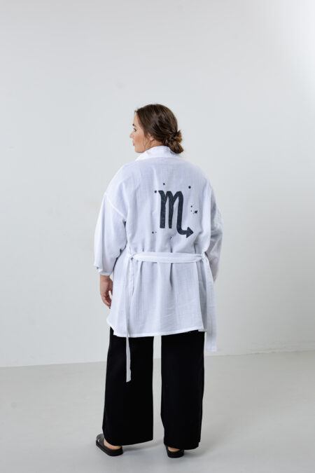 Hand-painted zodiac mini muslin kimono; multi-color naturally dyed jacket with black celestial symbols for sustainable resort wear and travel.