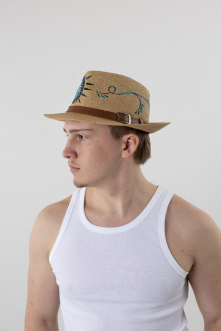 Man wearing a hand-painted Lucky Eye straw fedora for summer vacation.
