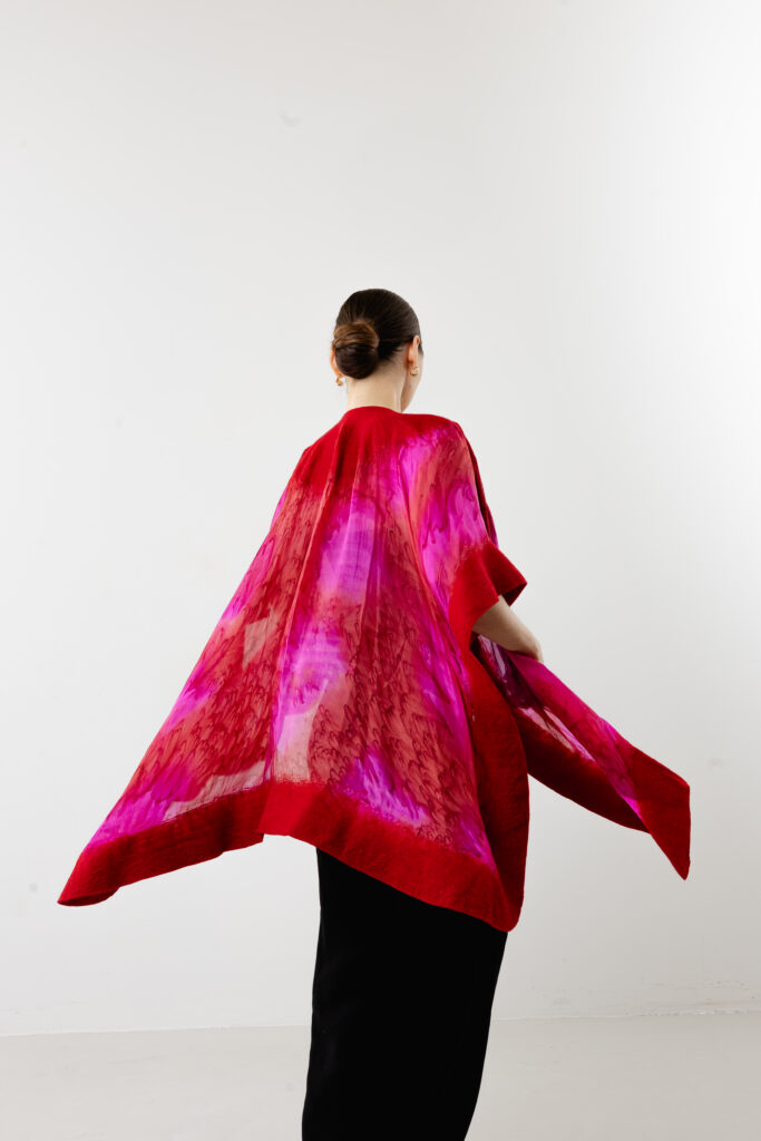 Intricate Nuno felted red wool on premium crimson silk - Silk-felt fusion
