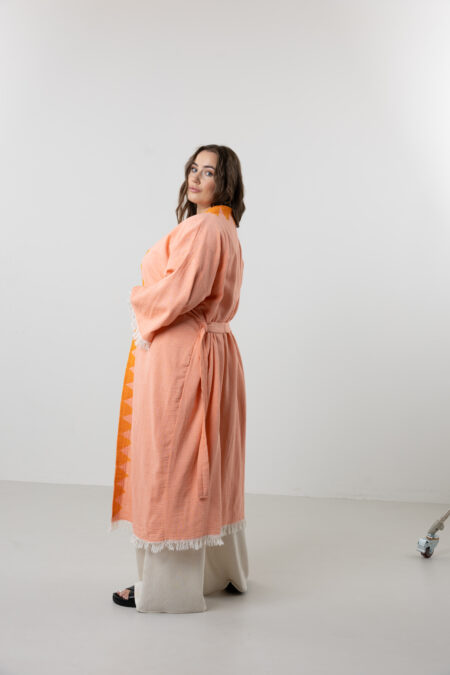 Styling a salmon pink artisanal cotton kimono for a chic summer look.