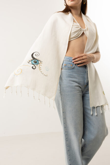 Artisanal hand-painted lucky eye cotton scarf styled as a classic neck wrap.