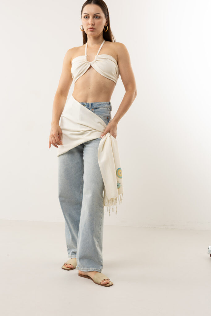 Bohemian style: Hand-painted cotton scarf worn as a creative headpiece.