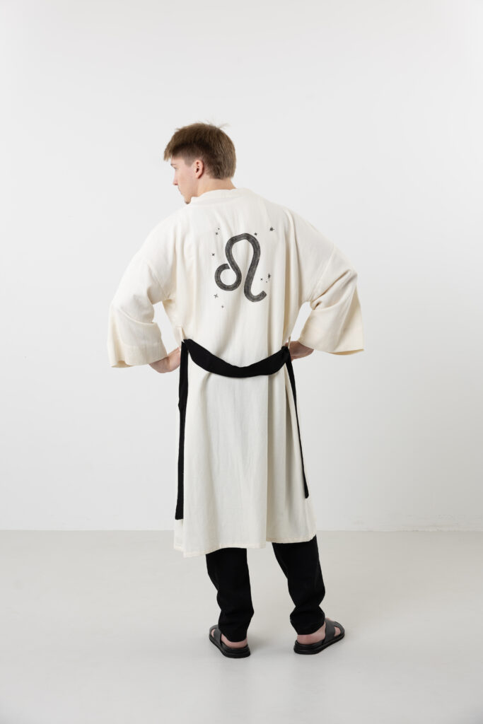Unique hand-painted zodiac sign natural cotton long kimono; unisex artisanal black and cream duster for sustainable bohemian style and mystical loungewear.