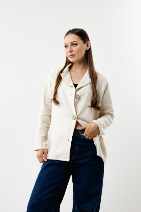 Women’s natural cream linen shirt styled for a minimal and chic summer look.