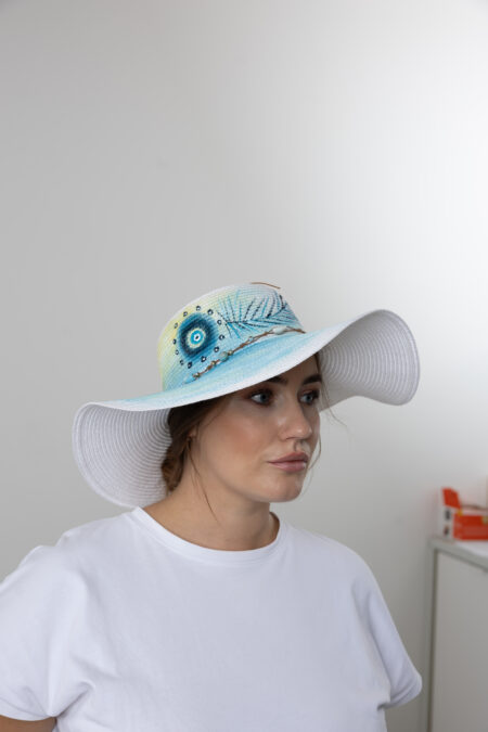 Women’s summer straw hat with hand-painted Turkish Lucky Eye pattern.